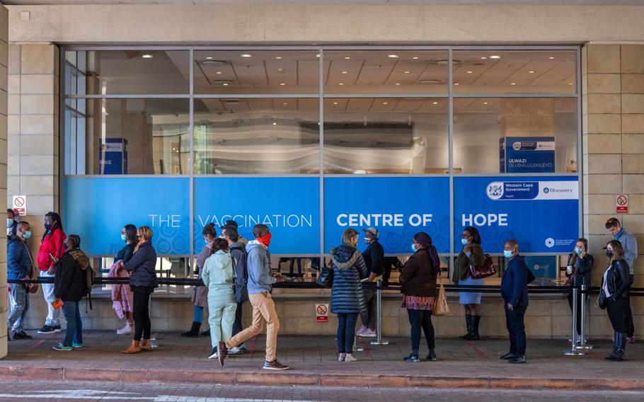 Residents line up outside the Discovery Ltd. mass vaccination site at the Cape Town International Convention Centre in Cape Town, South Africa, on Sept. 7, 2021.