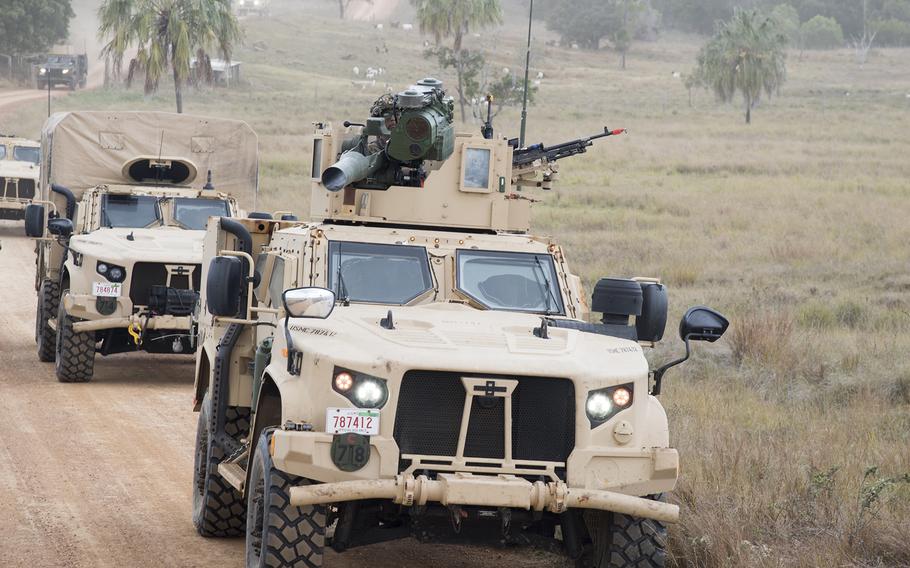 U.S. military vehicles take part in the Talisman Sabre finale near Stanage Bay, Australia, Wednesday, Aug. 2, 2023. 