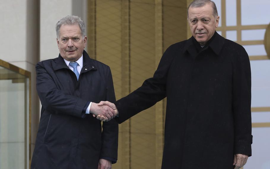 Turkish President Recep Tayyip Erdogan, right, and Finland’s President Sauli Niinistö shake hands during a welcome ceremony at the presidential palace in Ankara, Turkey, Friday, March 17, 2023.