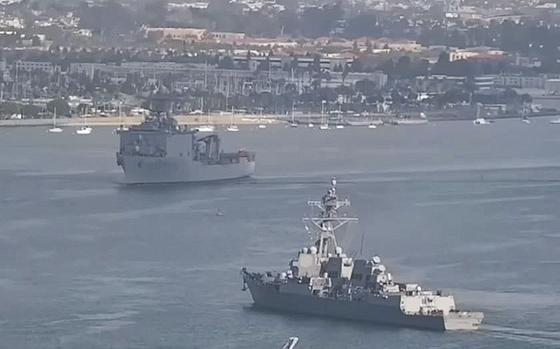 A video screen grab shows the USS Harper’s Ferry, top left, preparing to turn left through a tight channel in the San Diego Bay, as the USS Monsen prepares to turn right. The two ships nearly collided on Tuesday, Nov. 29, 2022.