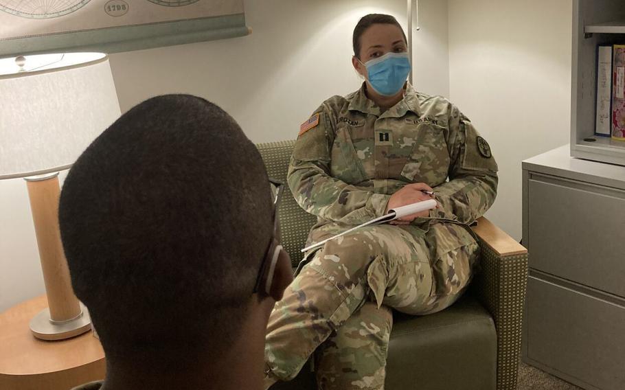 Capt. Ioana Horotan, staff psychiatrist at Blanchfield Army Community Hospital at Fort Campbell, Ky., speaks with a soldier about substance use disorder in April 2021.