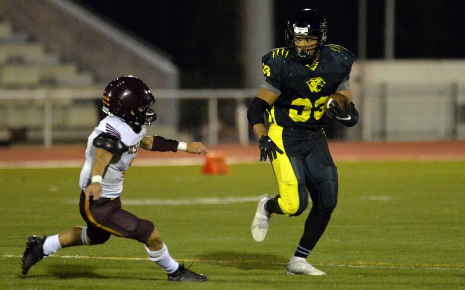 Stuttgart’s Trenton Jackson keeps his eyes of Vilseck’s Gabriel Morell as he rushes for yardage in Stuttgart’s 51-12 win over the Falcons in the DODEA-Europe Division I football championship game at Kaiserslautern, Germany, Oct. 29, 2022.