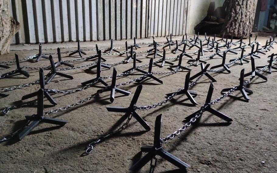 Art of Steel in Rivne, Ukraine, is making chain-linked caltrops to stop Russian vehicles at its city's checkpoints. The workshop typically makes medieval armor for sport but is now contributing to the war effort. 