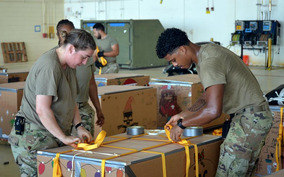 Airmen at Andersen Air Force Base, Guam, complete final preparations for supply bundles bound for remote Pacific islands as part of Operation Christmas Drop, Monday, Dec. 5, 2022. 