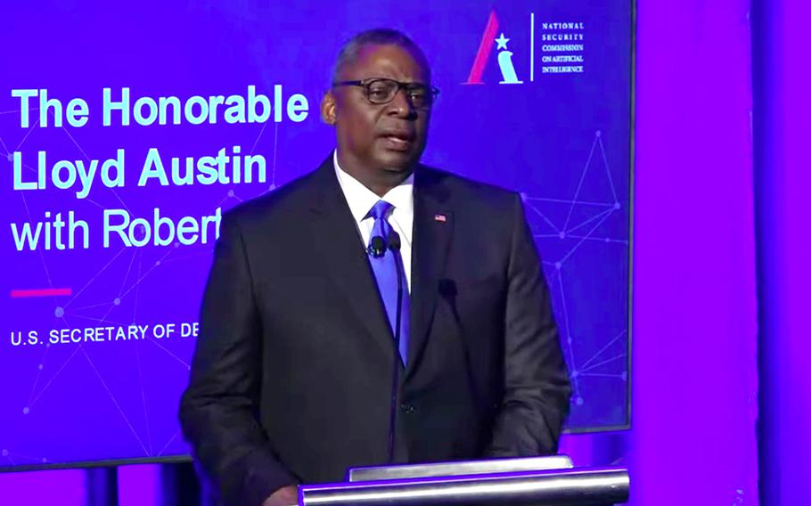 Defense Secretary Lloyd Austin addresses the National Security Commission on Artificial Intelligence at its 2021 summit in Washington on global emerging technology. A recently published Army notice asks the defense industry to design AI software that can predict an enemy's battlefield tactics.