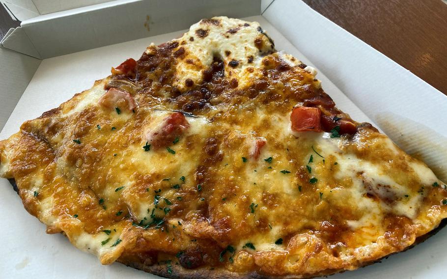 Fuji-Q Highland has 20 eateries serving a variety of snacks, including this Mount Fuji-shaped pizza with a snow cap of cheese. 
