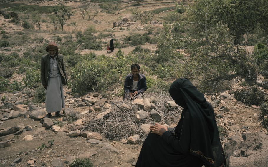 Mohammed Fulait Ahmed and his wife Anisa Ali Mohammed sit near the grave of their son Ali, who died three days earlier of complications arising from malnutrition. 