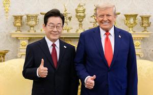 President Donald Trump and South Korean President Lee Jae-myung stand side-by-side with their thumbs up during a White House photo op.