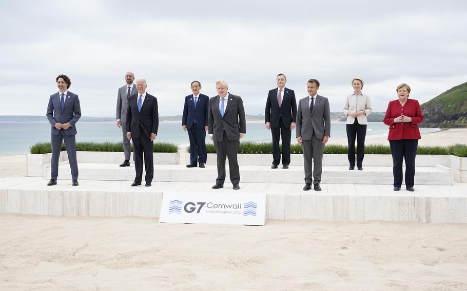 Leaders of the G7 pose for a group photo on overlooking the beach at the Carbis Bay Hotel in Carbis Bay, St. Ives, Cornwall, England, Friday, June 11, 2021. Leaders from left, Canadian Prime Minister Justin Trudeau, European Council President Charles Michel, U.S. President Joe Biden, Japan's Prime Minister Yoshihide Suga, British Prime Minister Boris Johnson, Italy's Prime Minister Mario Draghi, French President Emmanuel Macron, European Commission President Ursula von der Leyen and German Chancellor Angela Merkel.