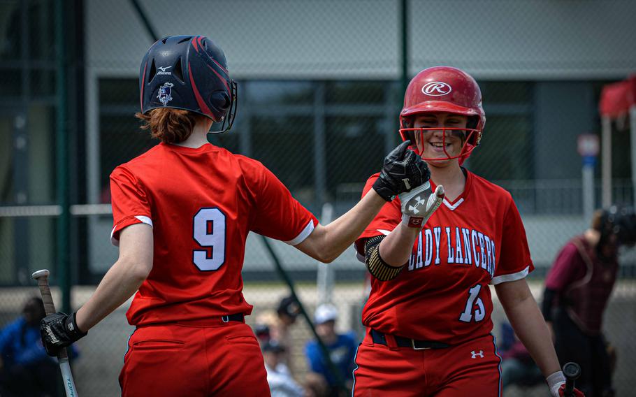 Lakenheath Lancer Emerson Melkersman, right, high fives her teammate Kendall Wilson after a successful play during the DODEA-Europe Softball Championships in Kaiserslautern, Germany, May 18, 2023.