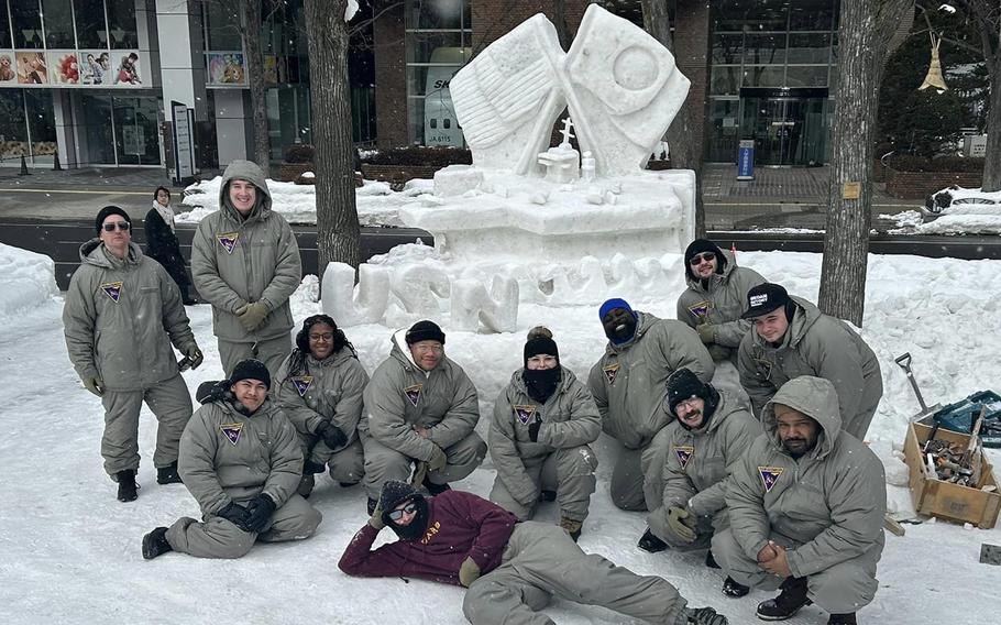 Naval Air Facility Misawa sailors pose with their snow carrier at the Sapporo Snow Festival in Hokkaido, Japan, Feb. 3, 2024. 
