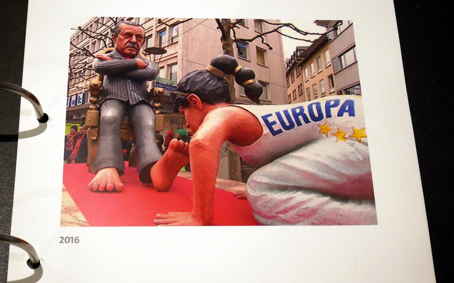 One element of the Mainz carnival that can’t be displayed at the Fastnachtsmuseum is parade floats. A book on display shows sketches of floats and the final product. Here, a picture of a 2016 float shows Europe kissing Turkish President Recep Tayyip Erdogan’s foot for his help in stemming the Syrian refugee tide to the Continent.