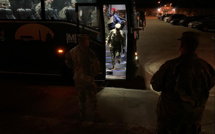 54th Quartermaster Company Soldiers exit the bus to attend a welcome home ceremony for the unit on April 12, 2024, at the Family Life Center on Fort Gregg-Adams, Va.