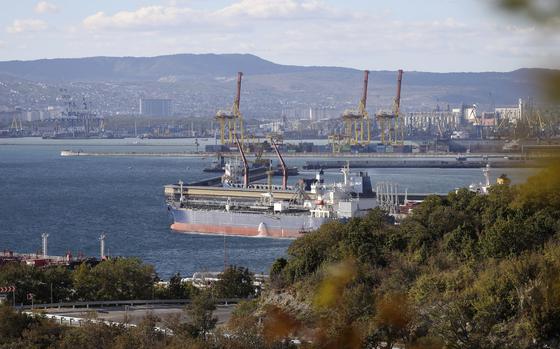 FILE - An oil tanker is moored at the Sheskharis complex, part of Chernomortransneft JSC, a subsidiary of Transneft PJSC, in Novorossiysk, Russia, on Oct. 11, 2022, one of the largest facilities for oil and petroleum products in southern Russia. Oil prices rose Monday Dec. 5, 2022 as the first strong measures to limit Russia's oil profits over the war in Ukraine took effect, bringing with them uncertainty about how much crude could be lost to the global economy through the new sanctions or Russian retaliation. (AP Photo, File)