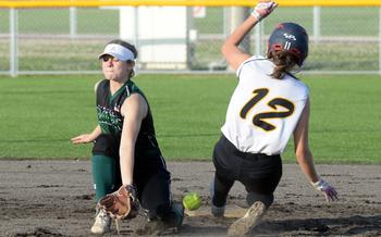 Kubasaki shortstop Kristin Lininger can't find the handle as Kadena's Mykiah Pearce slides safely into second base during Tuesday's DODEA-Okinawa softball game. The Panthers won 18-3 in four innings.