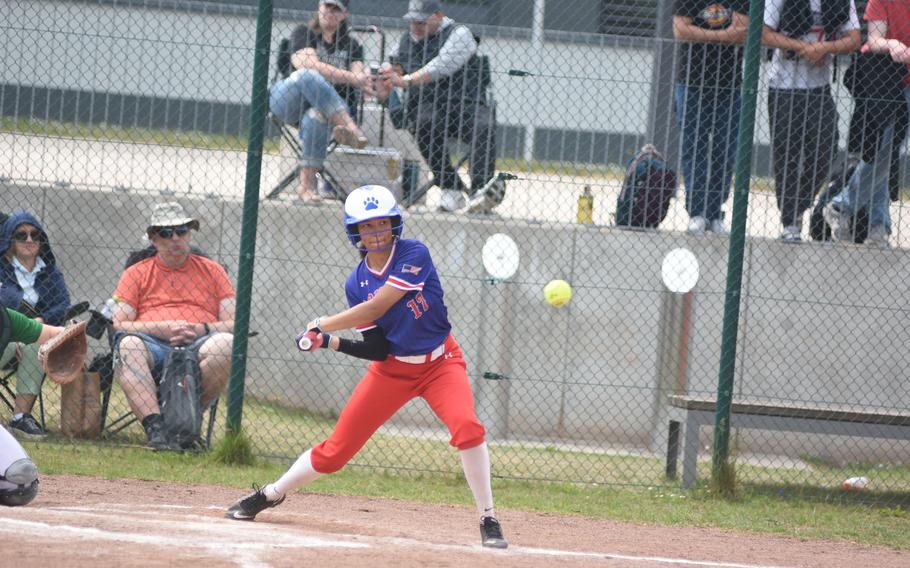 Ramstein's Sanai Schneider takes a swing Wednesday, May 21, 2025 at the opening day of the DODEA-Europe Division I softball championships at Kaiserslautern, Germany.