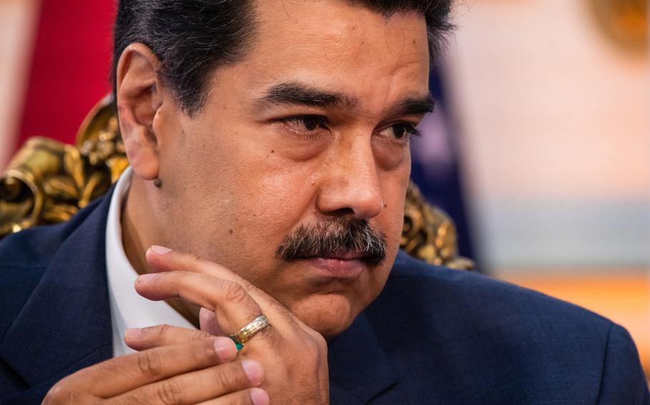 Venezuela’s President Nicolas Maduro listens during an interview in Caracas on June 13, 2021. 