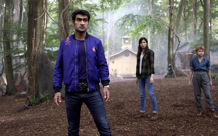 From left: Kingo (Kumail Nanjiani), Sersi (Gemma Chan) and Sprite (Lia McHugh) are on Earth to save the day in “Eternals.” 