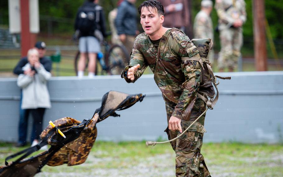 A soldier throws a life preserver 
