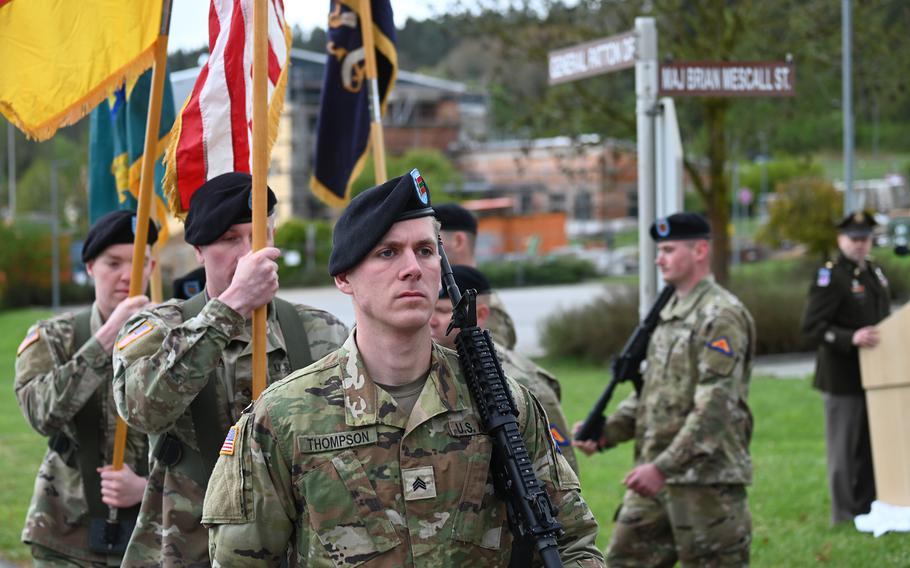 An honor guard marches during a street renaming ceremony for Army Maj. Brian Mescall at Hohenfels Training Area, Germany, on Thursday, April 18, 2024. 
