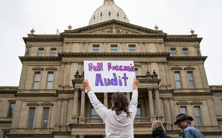 Supporters of former president Donald Trump gather for a rally at Michigan State Capitol in Lansing in October 2021 to demand a forensic audit of the 2020 election. 