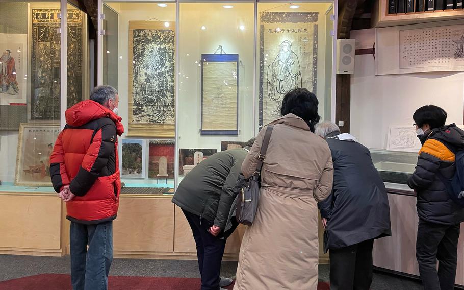 The main lecture hall at Gwollisa Shrine in Osan, South Korea, houses many statues and artifacts, including writings that date back centuries. Images of Confucius are found throughout the site.