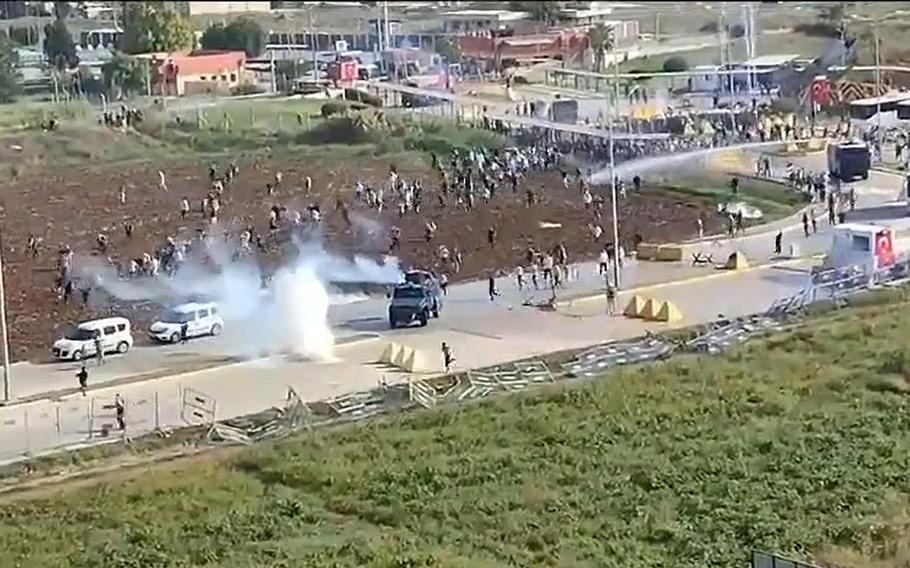 In a screen shot from social media, Turkish police use tear gas and water cannons to disperse protesters at a pro-Palestinian rally Nov. 5, 2023, outside Incirlik Air Base near the southeastern city of Adana.