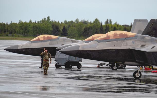 U.S. Air Force Staff Sgt. Isaiah Eyeland of the 90th Fighter Generation Squadron salutes an F-22 Raptor pilot June 3, 2025, in Alaska during Exercise Tropic Tundra, in preparation for Exercise Resolute Force Pacific.