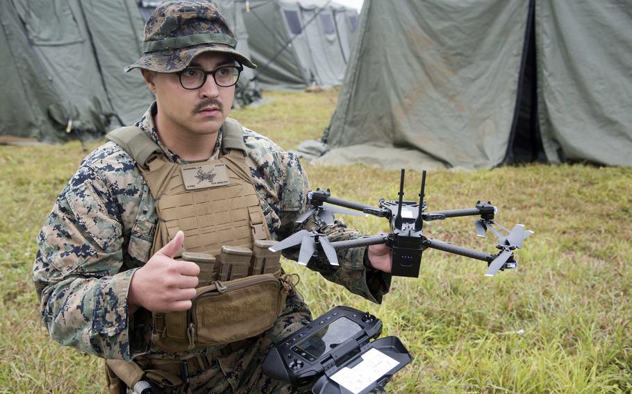 A Marine gives the all-clear for flight while demonstrating the Skydio X2D unmanned aircraft system.