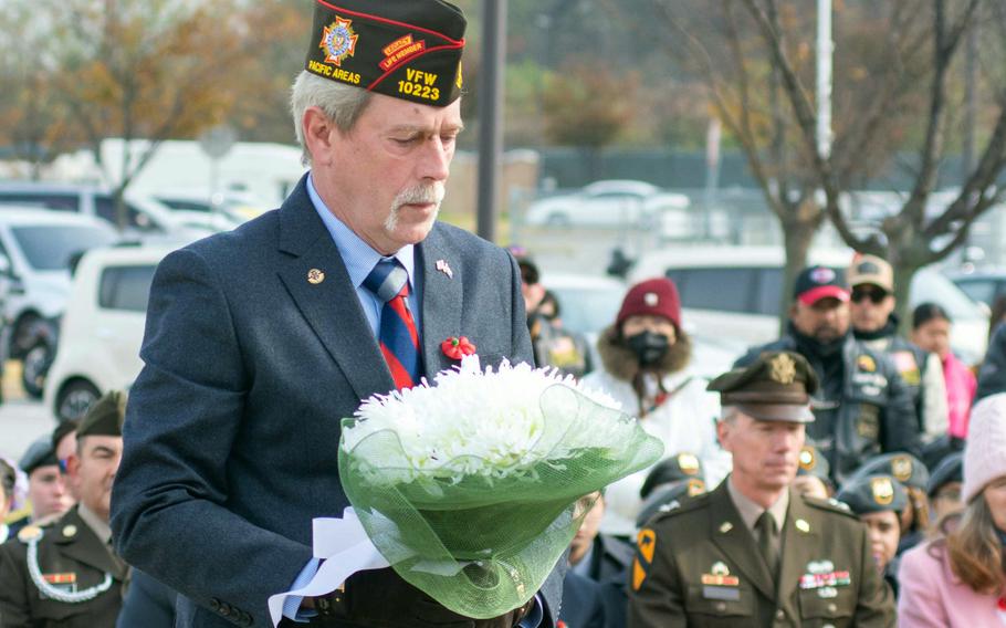Don Kelley, chief of staff for VFW Department of Pacific Areas, lays a Veterans Day wreath at an Army memorial on Camp Humphreys, South Korea, Nov. 11, 2023.