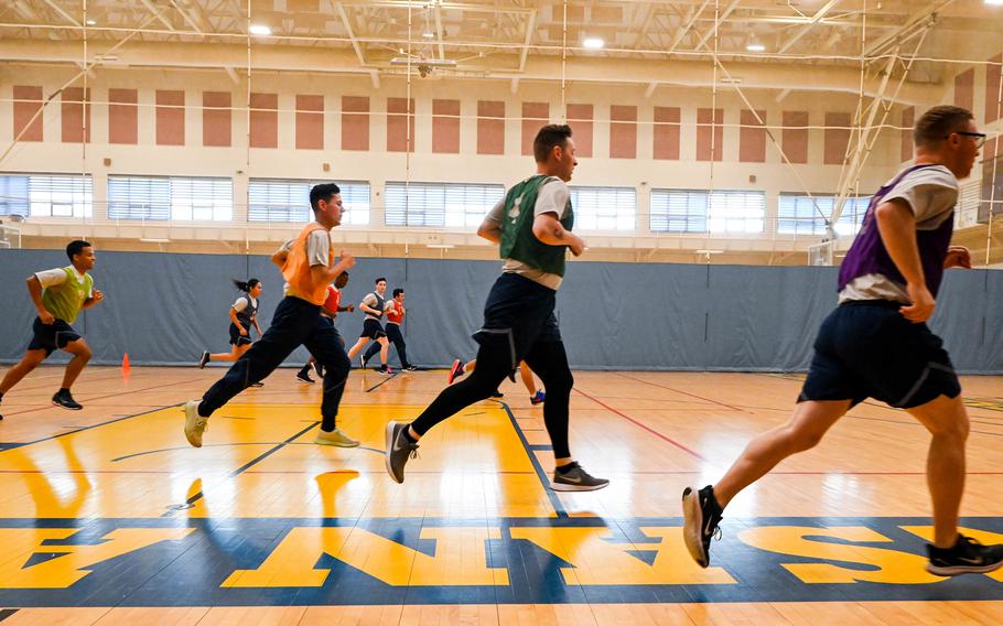 Airmen with the 8th Fighter Wing do the 20-meter shuttle run during an Air Force physical fitness assessment beta test at Kunsan Air Base, South Korea, in August 2021. The service recently revamped its PT test to offer more options and updated its scoring charts. 