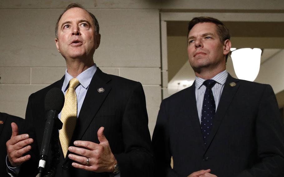 In this May 28, 2019, file photo, Rep. Adam Schiff, D-Calif., left, and Rep. Eric Swalwell, D-Calif., speak with members of the media on Capitol Hill in Washington.