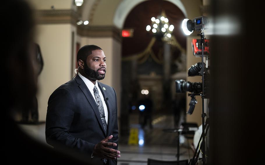 Rep. Byron Donalds, R-Fla., participates in a television interview on Capitol Hill on Jan. 9, 2023. 