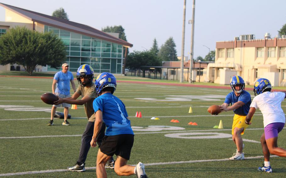 Yokota football players practice.