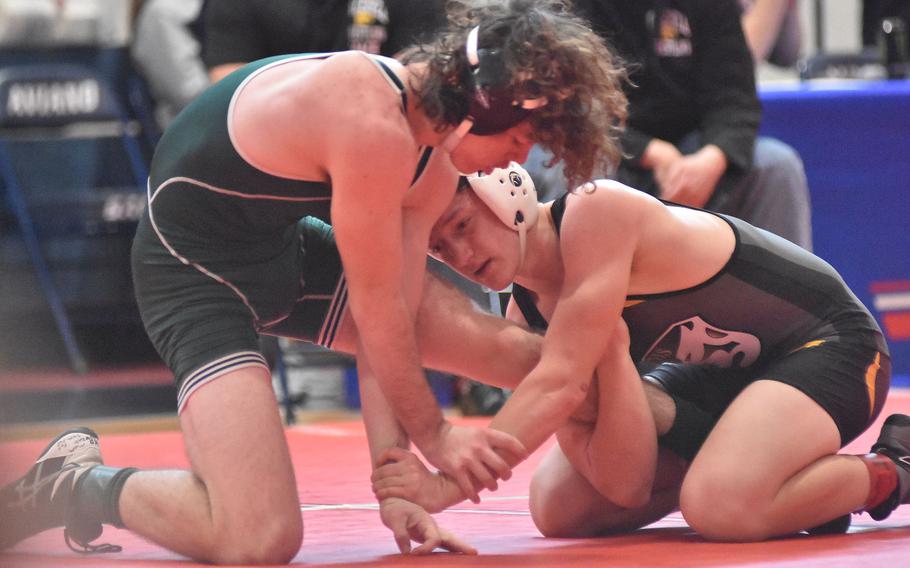 Vicenza's Paul Sturtevant has Naples' Collin Murphy by the leg in a 138-pound match Saturday, Feb. 4, 2023, at the DODEA-Europe Southern Europe regional at Aviano Air Base, Italy. Sturtevant won the match.