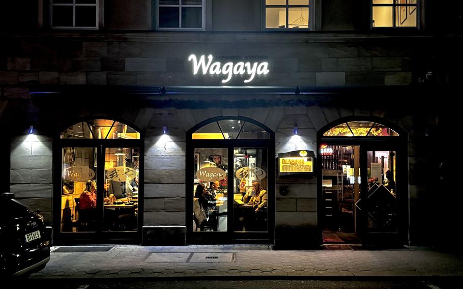 The outside of Wagaya, a Japanese sushi restaurant at night,