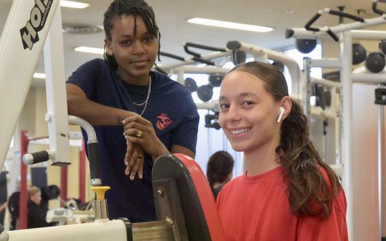 Lane Cpl. Keilm Rodriguez, 21, right, of the Marine Corps 3rd Transportation Battalion at Camp Foster, Okinawa, Japan, at the base gym on Dec. 20, 2022, said she resolved to read the Bible more frequently and get closer to her family in 2023.