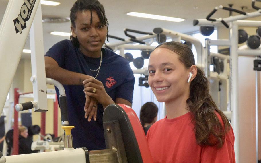 Lance Cpl. Keilm Rodriguez, 21, right, of the Marine Corps 3rd Transportation Battalion at Camp Foster, Okinawa, Japan, at the base gym on Dec. 20, 2022, said she resolved to read the Bible more frequently and get closer to her family in 2023.