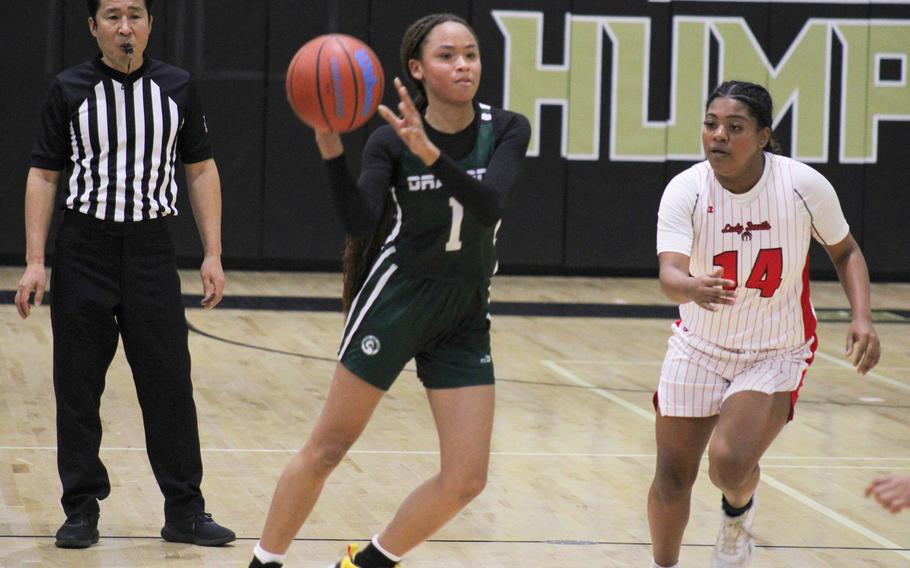 Kubasaki's Nevaeh Gilbert looks to pass upcourt as Kinnick's Michele Holloway gives chase. The Red Devils won 31-19.