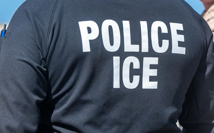 An ICE agent.