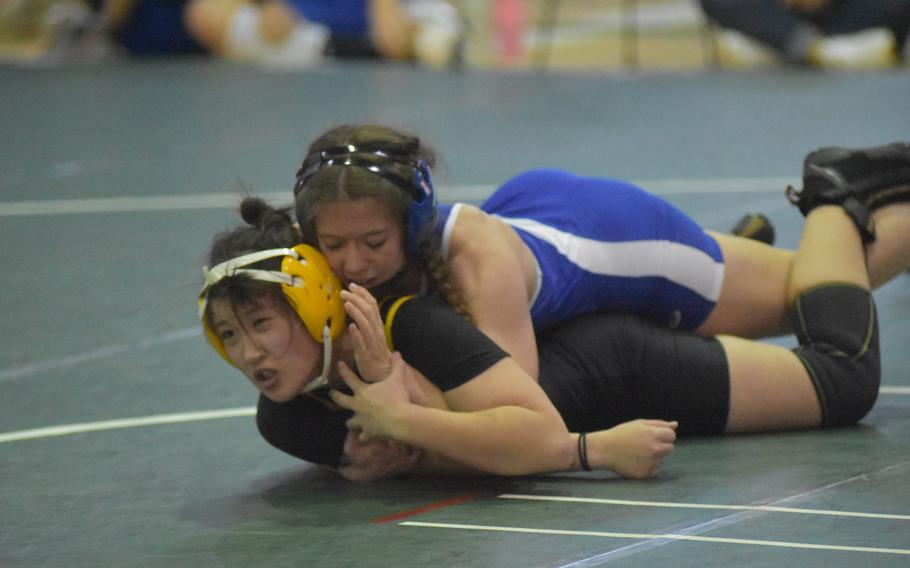 Ivy Anderson and Sarah Chambers compete during an opening round match of the DODEA Southern European Finals on Saturday, March 5, 2022 at Naples Middle High School. Anderson won the match on points. 