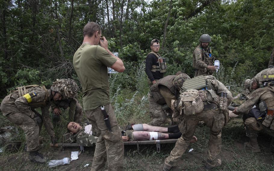 Wounded soldiers of the Ukrainian Airborne unit are treated outside the embattled city of Lysychansk, Ukraine on June 26, 2022. 