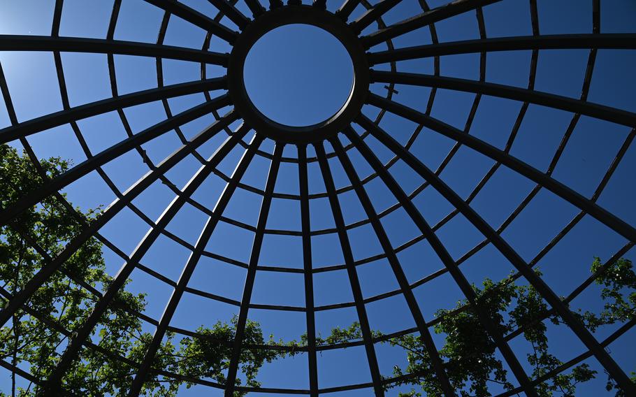 Roses climb the Rosendom, a rose cupola, at Rosenhoehe Park in Darmstadt, Germany. By the time the season is over in late autumn, the dome is covered with roses.