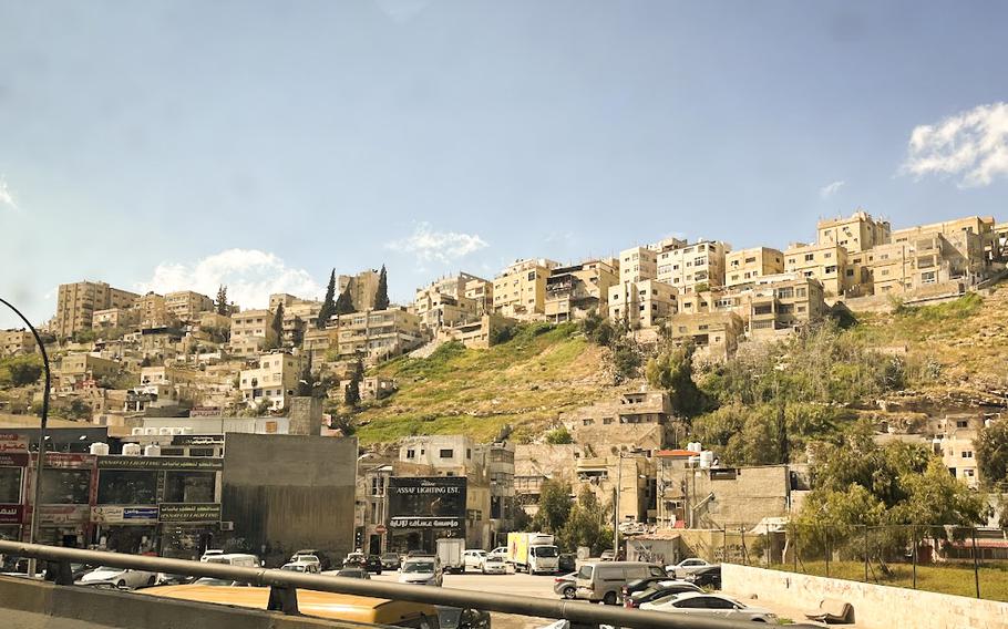 The colorful decorations on Rainbow Street often contrast with the rest of Amman, which can look quite monotone.