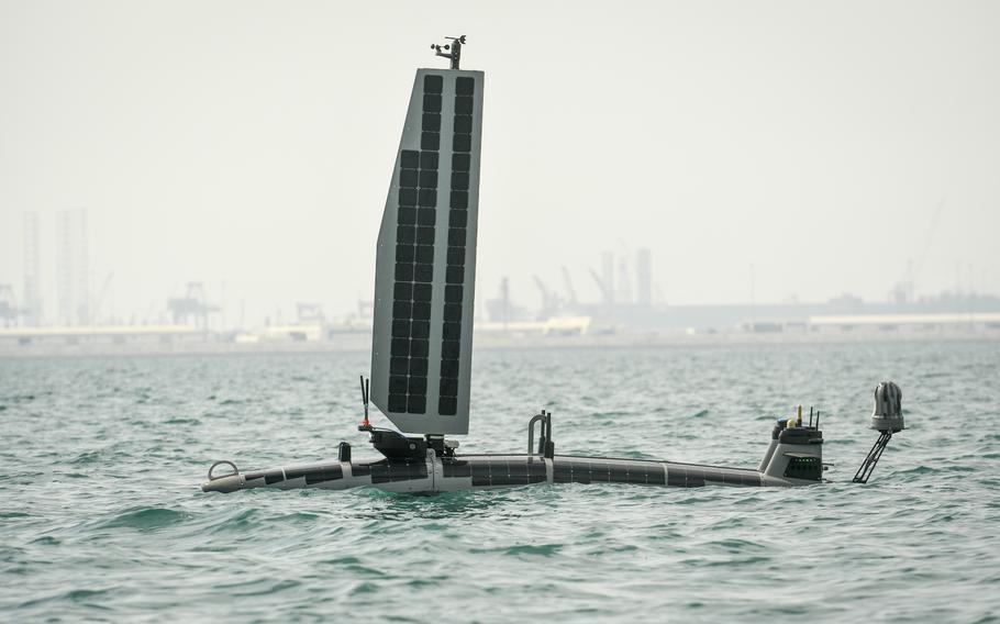 The unmanned vessel Ocean AeroTriton cruises through international waters between Naval Support Activity Bahrain and Iran, Nov. 30, 2022, as part of a naval exercise. The solar-powered drone can spend three months at sea on the surface, or eight days submerged. 
