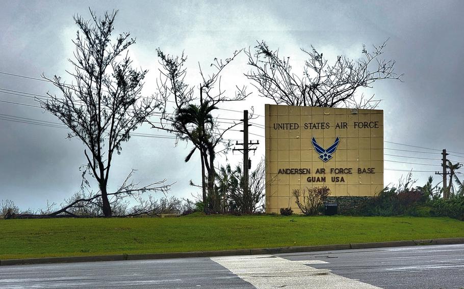 Fallen trees and debris surround a sign at Andersen Air Force Base, Guam, May 25, 2023, the day after Typhoon Mawar hit the island.