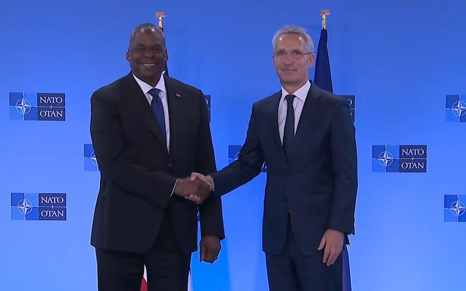 U.S. Defense Secretary Lloyd Austin, left, shakes hands with NATO Secretary General Jens Stoltenberg during opening remarks prior to a meeting of NATO defense ministers at NATO headquarters in Brussels, Thursday, June 16, 2022. NATO defense ministers on Thursday will discuss beefing up weapons supplies to Ukraine, and Sweden and Finland’s applications to join the transatlantic military alliance.