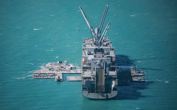 U.S. Army mariners construct a floating pier off the coast of Bowen, Australia, in July 2023. The pier is similar to one being constructed to move humanitarian aid into Gaza.