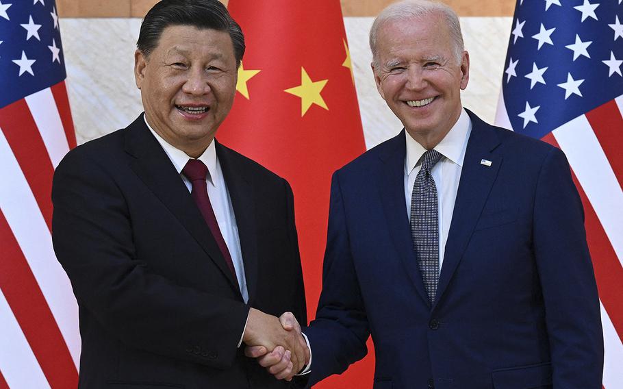 U.S. President Joe Biden, right, and China’s President Xi Jinping shake hands as they meet on the sidelines of the G-20 Summit in Nusa Dua on the Indonesian resort island of Bali on Nov. 14, 2022. 