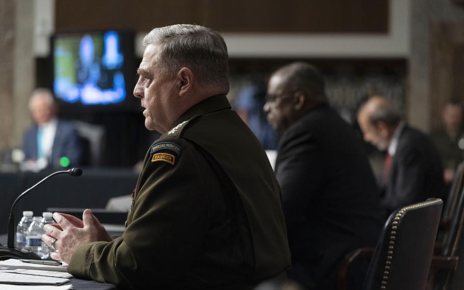 Chairman of the Joint Chiefs of Staff Gen. Mark Milley, left, accompanied by Secretary of Defense Lloyd Austin, speaks at a Senate Armed Services budget hearing on Capitol Hill in Washington, Thursday, June 10, 2021. 